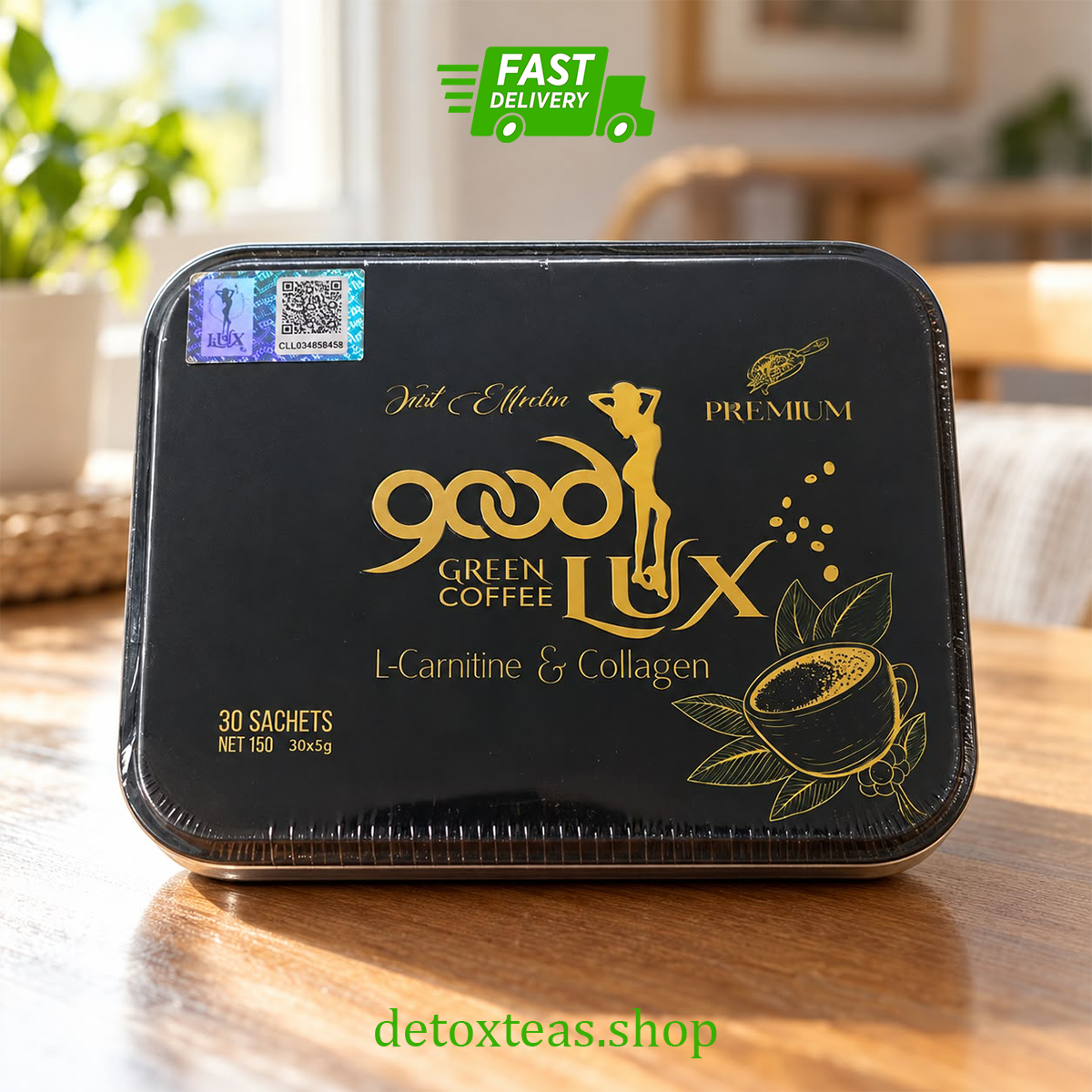 Black rectangular tin of Green Good Lux Coffee with gold lettering, sealed in film, standing on a wooden table